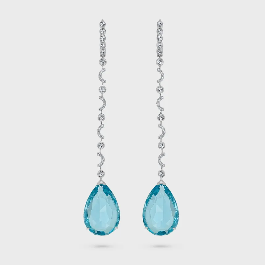 Soldeu Topaz white gold garland earrings by ValeOro with pear-shaped blue topaz drops below lines of diamonds, front view