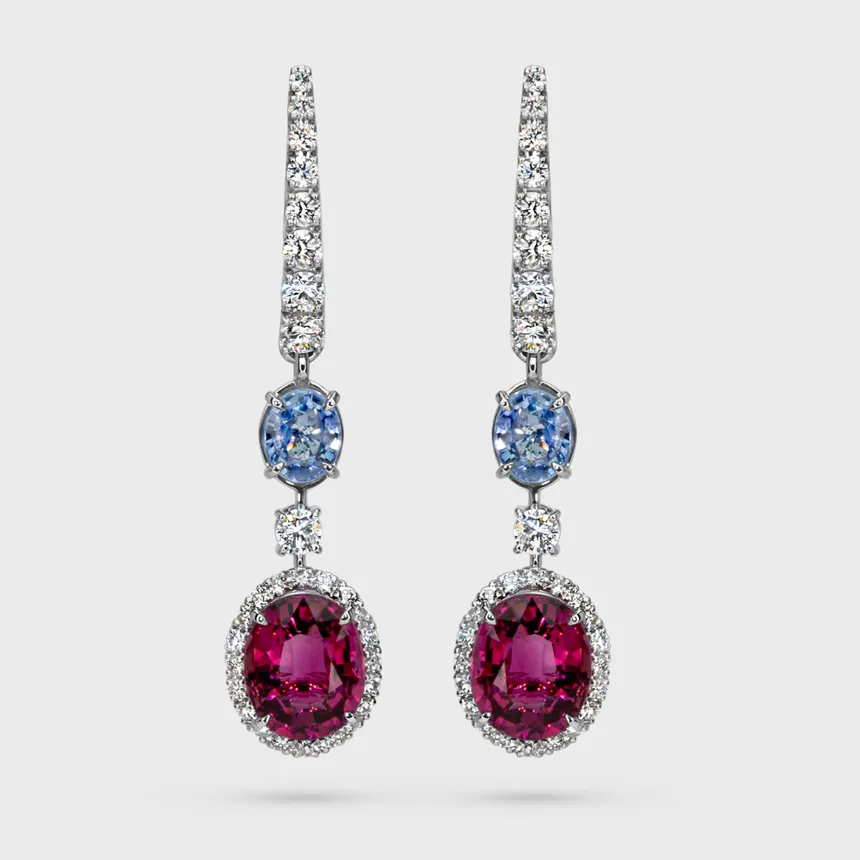 La Serena white gold drop earrings by ValeOro with oval pink tourmalines in diamond halos and blue sapphires, front view
