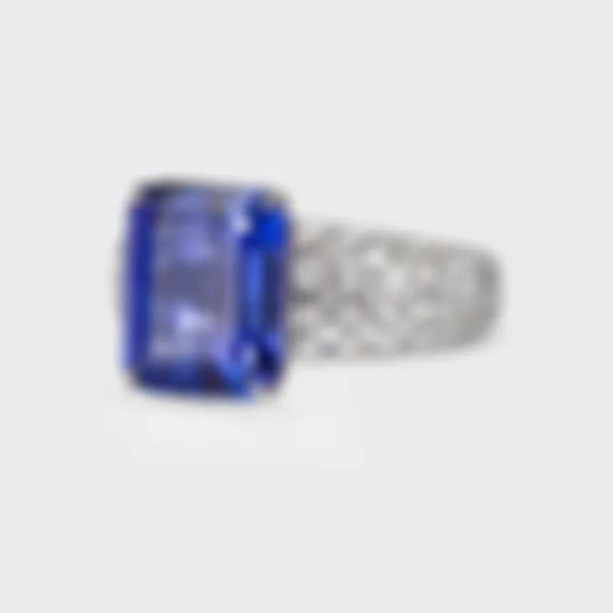 Sorteny Tanzanite white gold ring by ValeOro with an emerald-cut tanzanite on a diamond-paved band, side view
