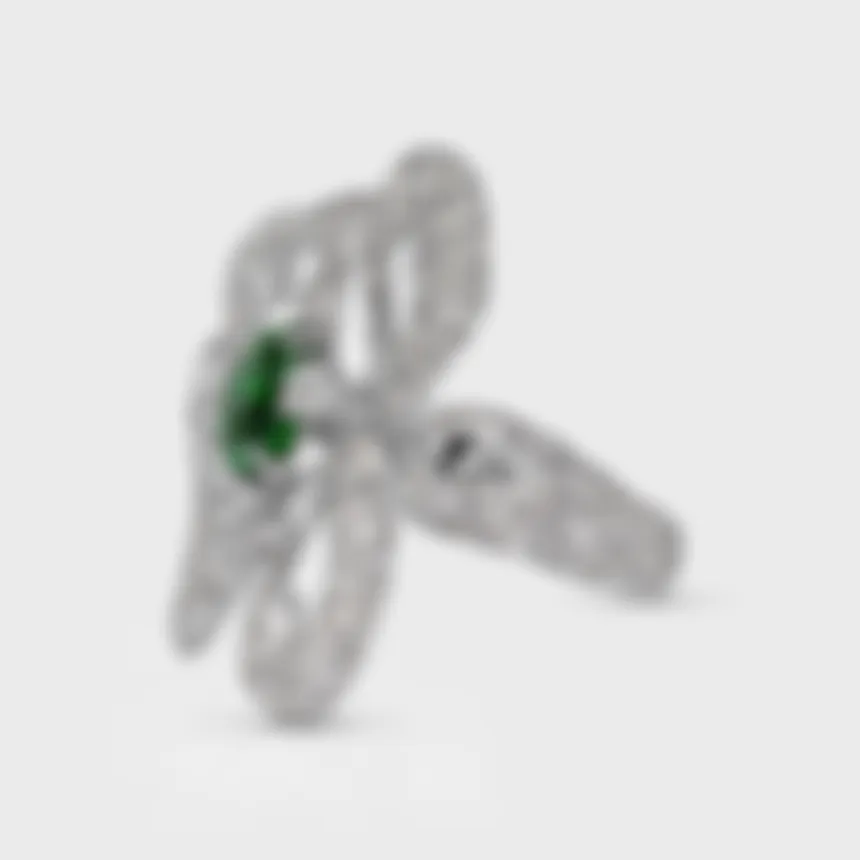 Protea Tsavorite white gold ring by ValeOro, green tsavorite in a sculpted diamond floral design, three-quarter view