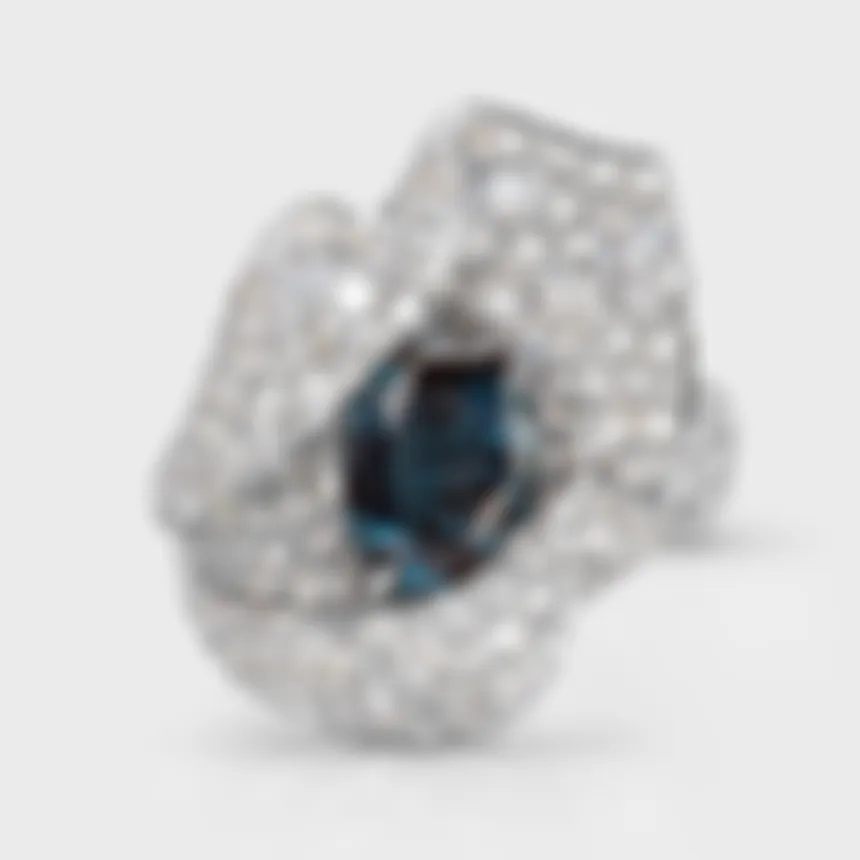Azure white gold ring by ValeOro with an oval blue spinel surrounded by scattered pavé diamonds, front view