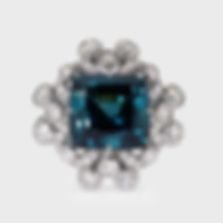 Genova white gold ring by ValeOro with a blue-green tourmaline framed by bezel-set diamonds, three-quarter view