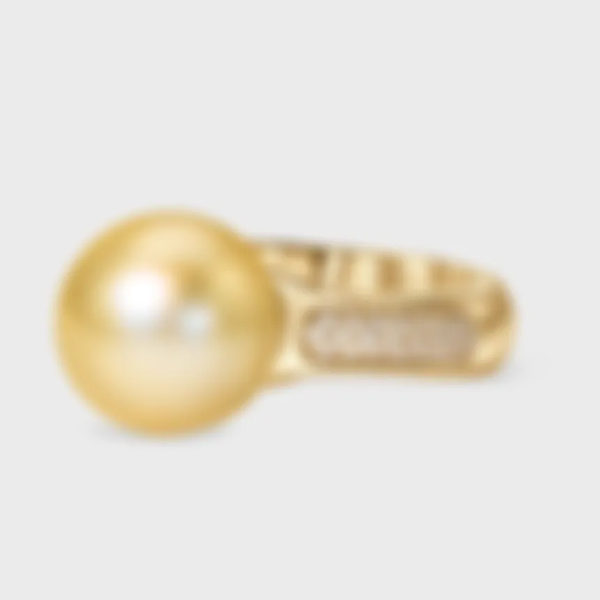 Katiu Yellow ring by ValeOro in yellow gold with a golden pearl and a pavé diamond band along the shank, side view
