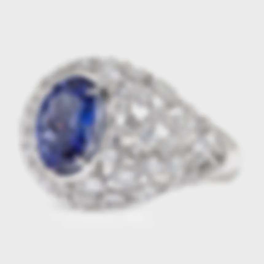 Venezia white gold ring by ValeOro with an oval blue-violet tanzanite above an openwork lattice gallery, three-quarter view