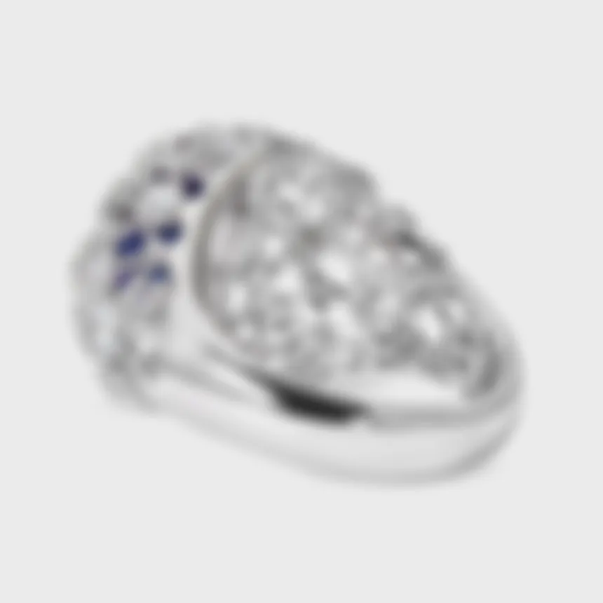 Venezia white gold ring by ValeOro with an oval blue-violet tanzanite on a diamond-scattered openwork dome, side view