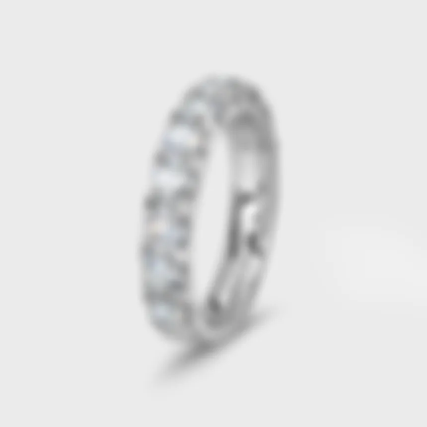 Gloss white gold ring by ValeOro with prong-set round diamonds along the band, three-quarter view