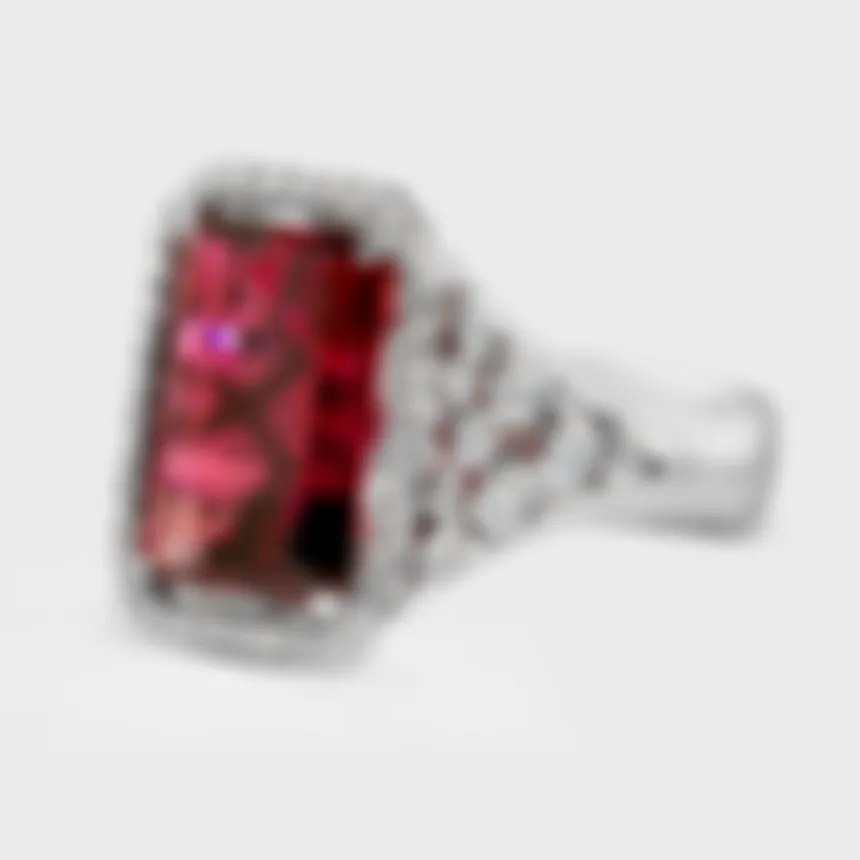 Alicante white gold ring by ValeOro with a red tourmaline and split shoulders set with round diamonds, three-quarter view