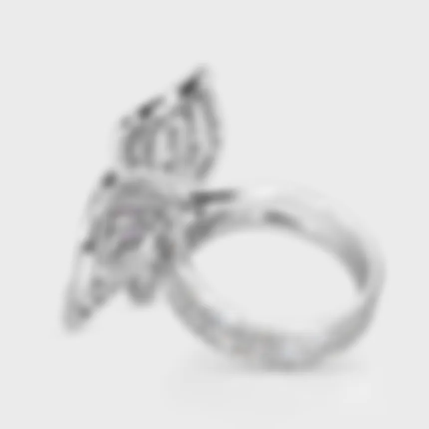 Moraea white gold ring by ValeOro with the openwork flower in profile and a diamond-set band, side view