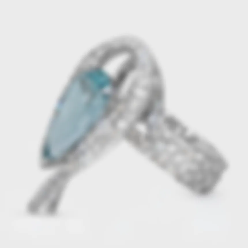 Vermont white gold ring by ValeOro with a light blue aquamarine and a pavé diamond band, three-quarter view