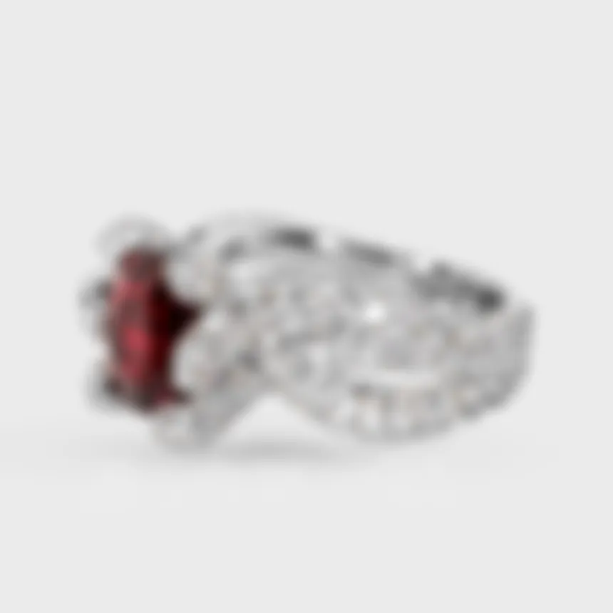 Caledon white gold ring by ValeOro with a red spinel held by diamond prongs on a braided band, side view