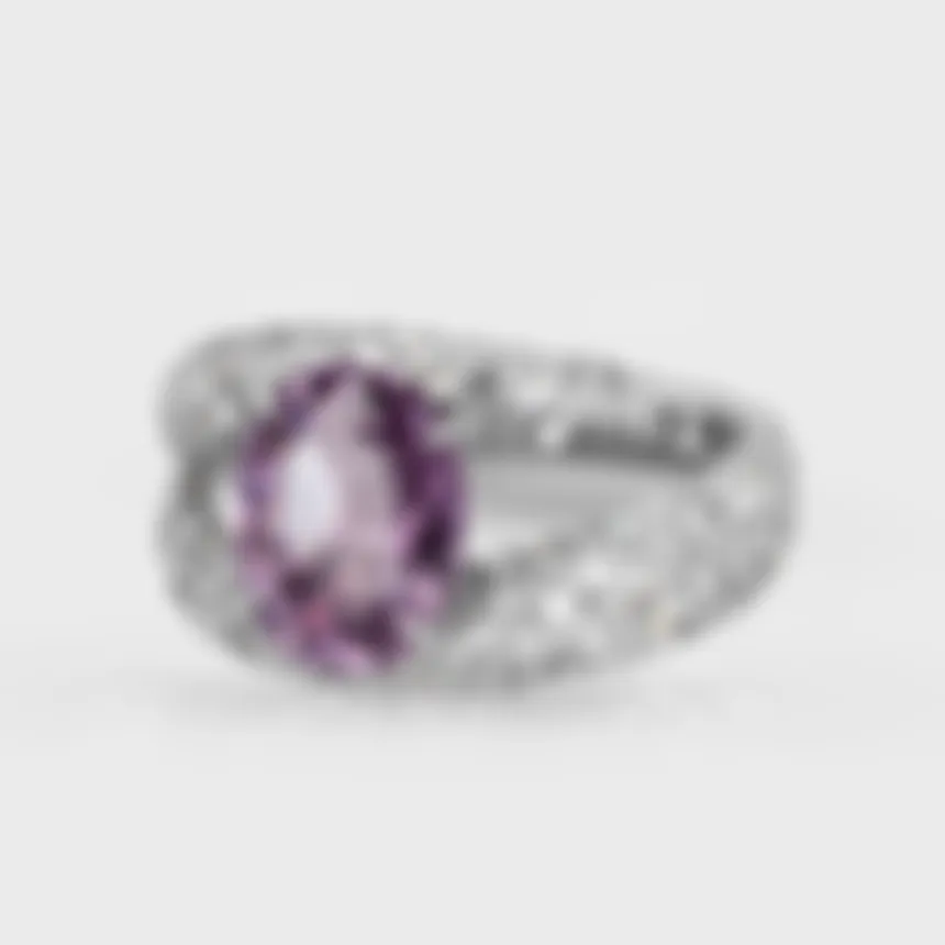 Onrus white gold ring by ValeOro with an oval violet spinel and diamonds covering the band, three-quarter view