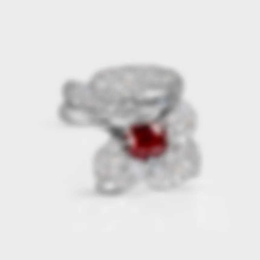 Lily white gold ring by ValeOro with a round red sapphire framed by diamond petals, front view