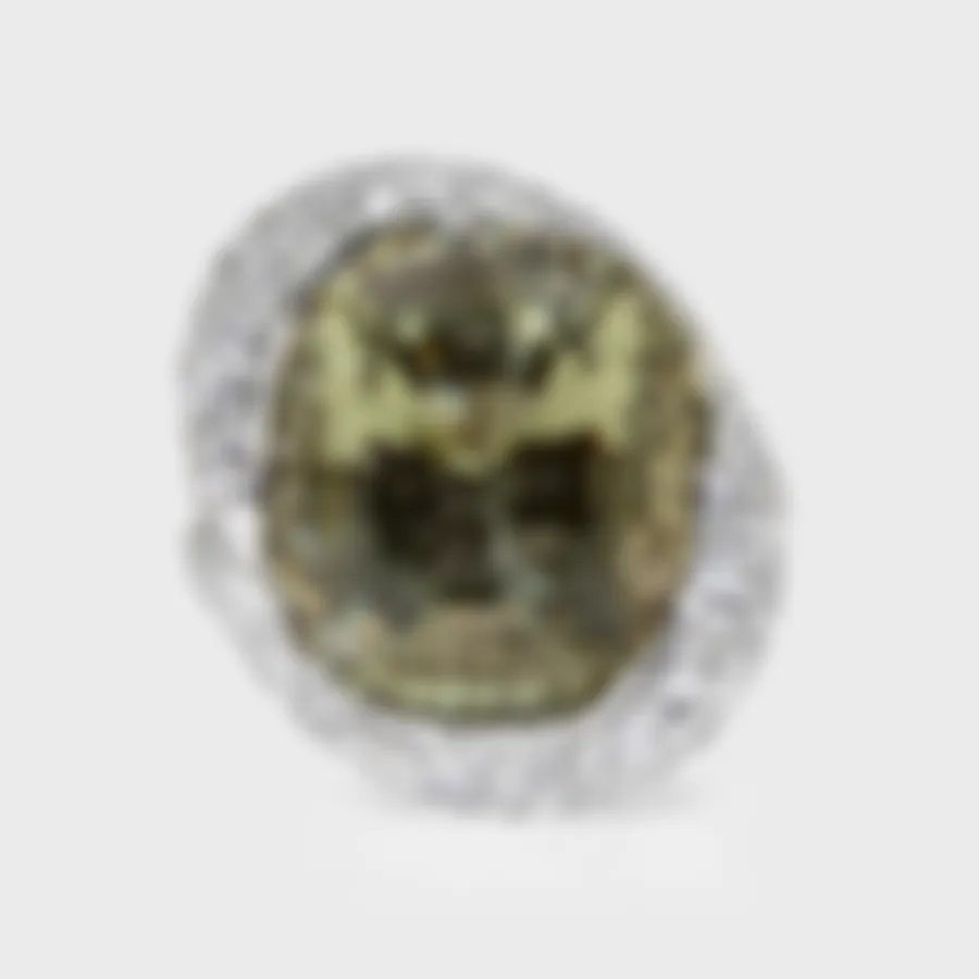 Anyos white gold ring by ValeOro with a large oval golden-green heliodor framed by diamond pavé, front view