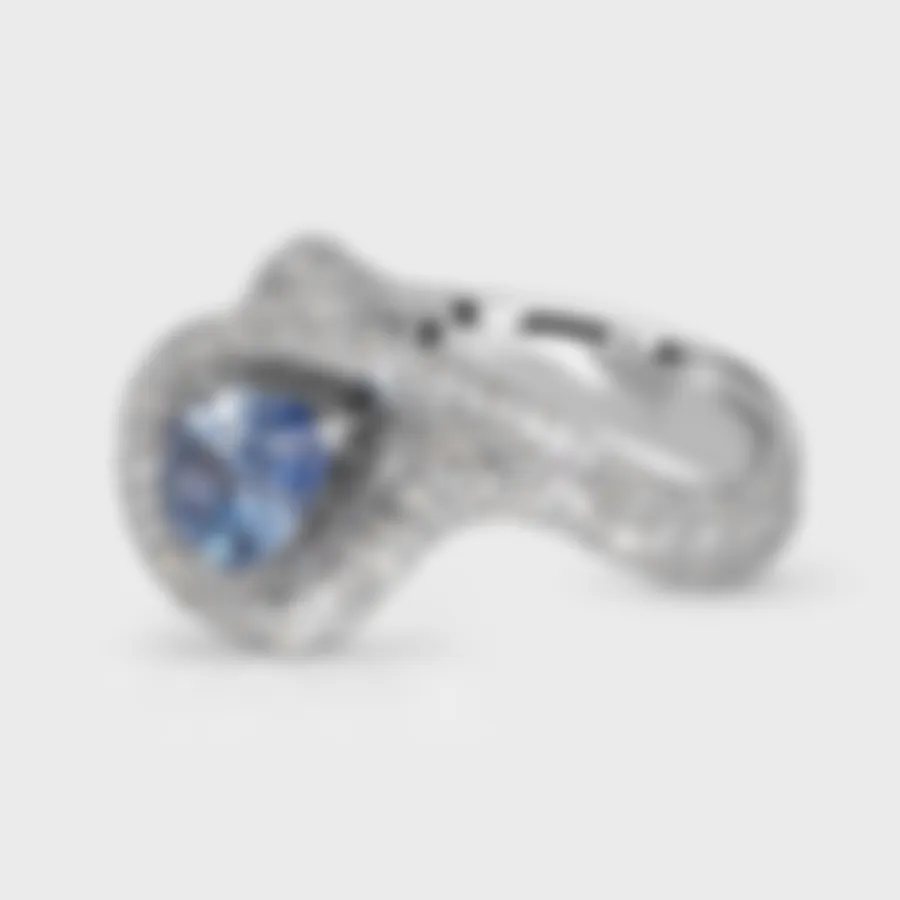 Yin-Yang Sapphire white gold ring by ValeOro with a light blue pear sapphire encircled by pavé diamonds, three-quarter view