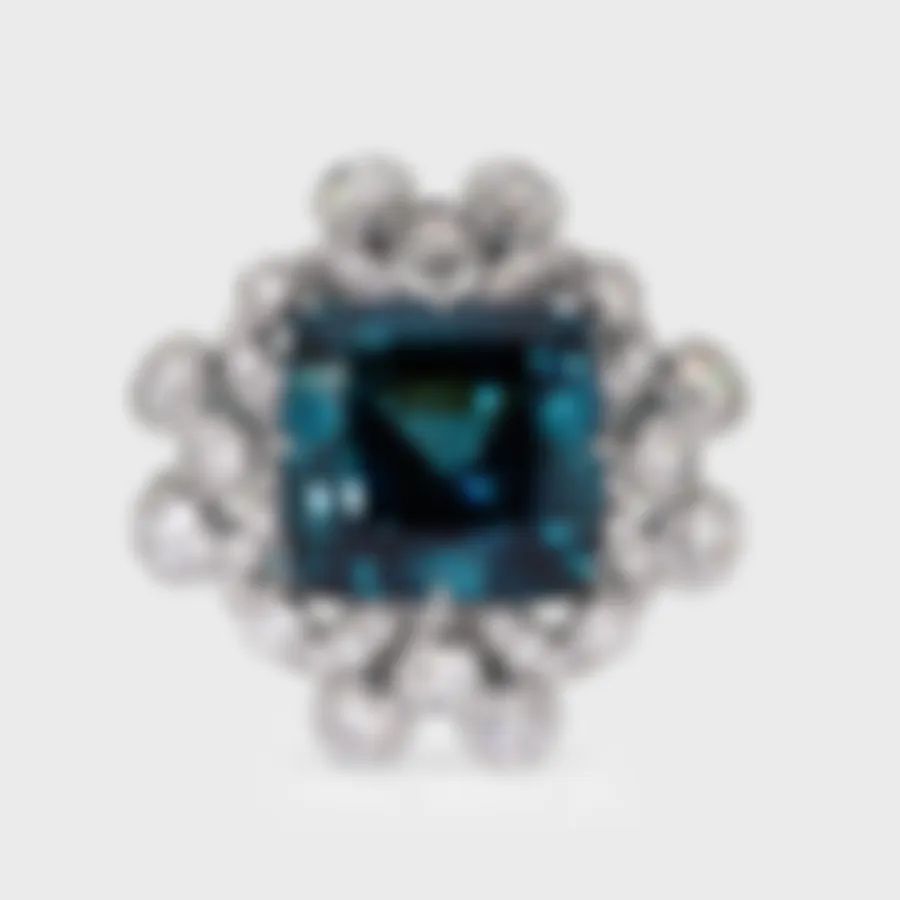 Genova white gold ring by ValeOro with a blue-green tourmaline framed by bezel-set diamonds, three-quarter view