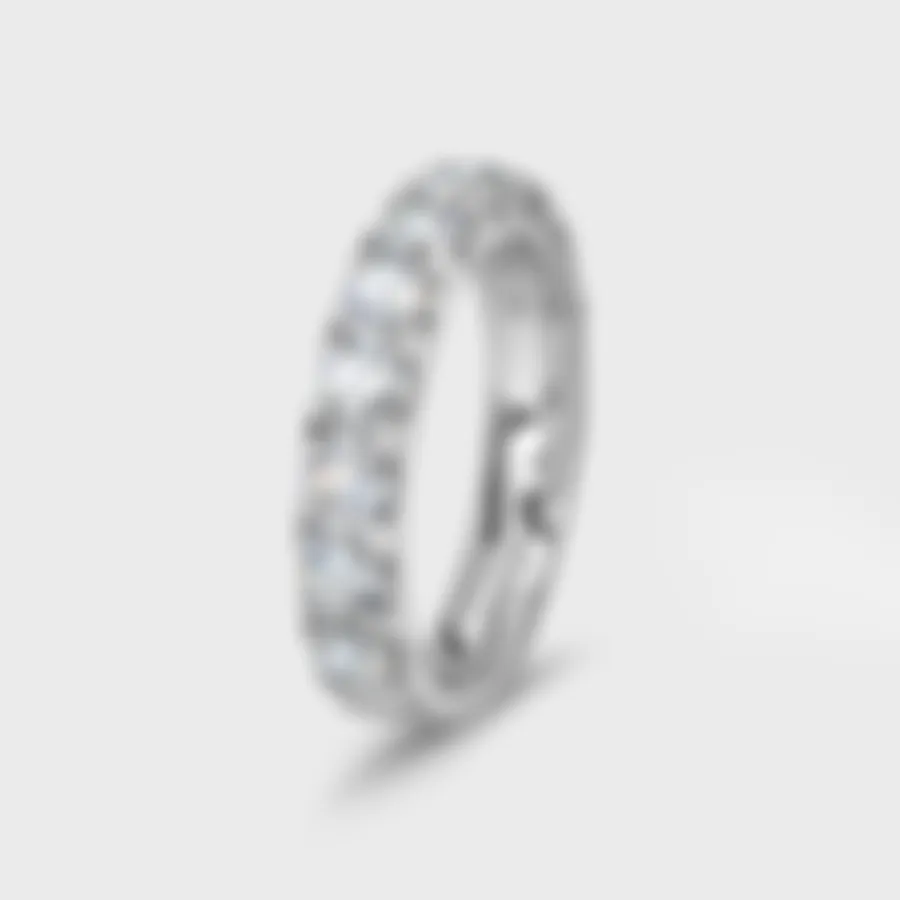 Gloss white gold ring by ValeOro with prong-set round diamonds along the band, three-quarter view