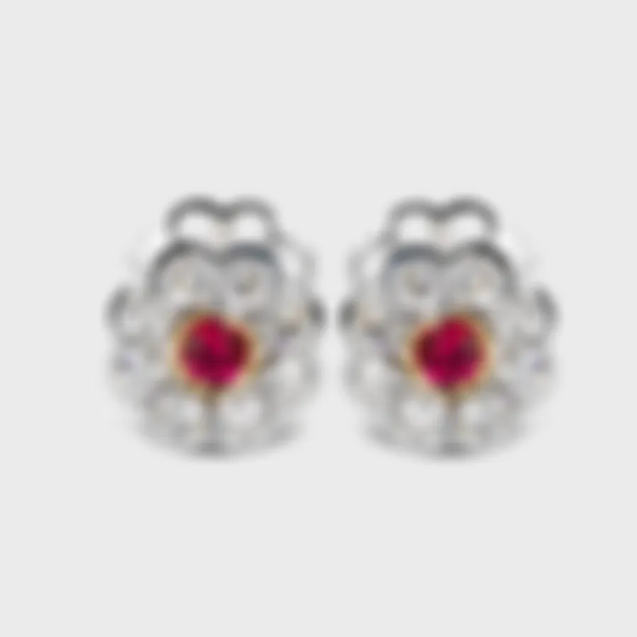 Amaryllis white gold earrings by ValeOro with round red spinels in yellow gold bezels framed by diamond petals, front view